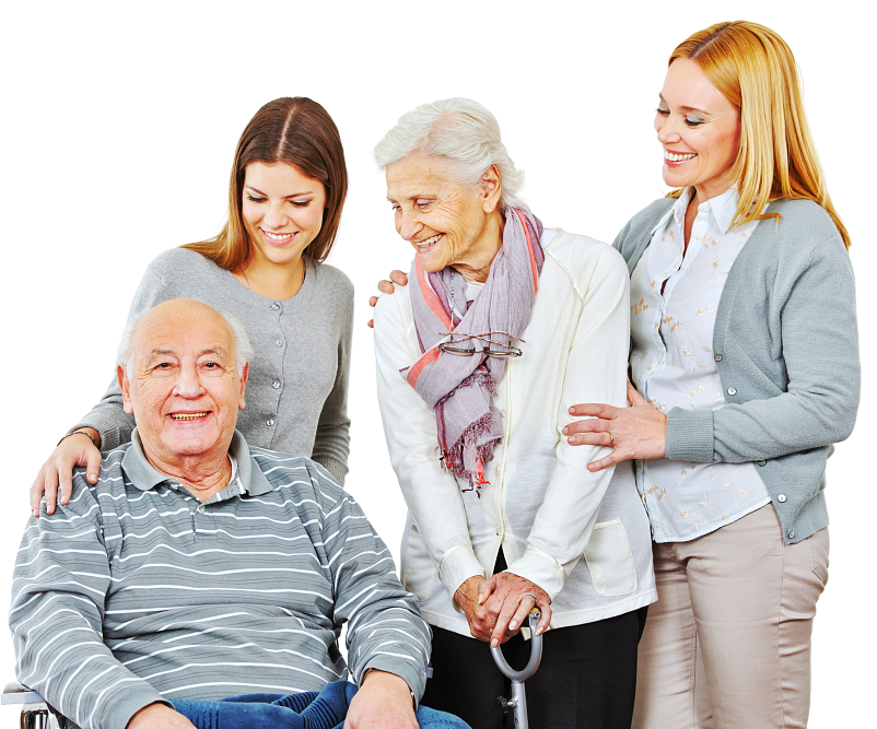 two female caregivers and couple senior are smiling