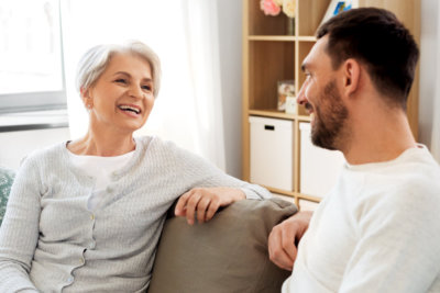 caregiver and senior woman having a conversation