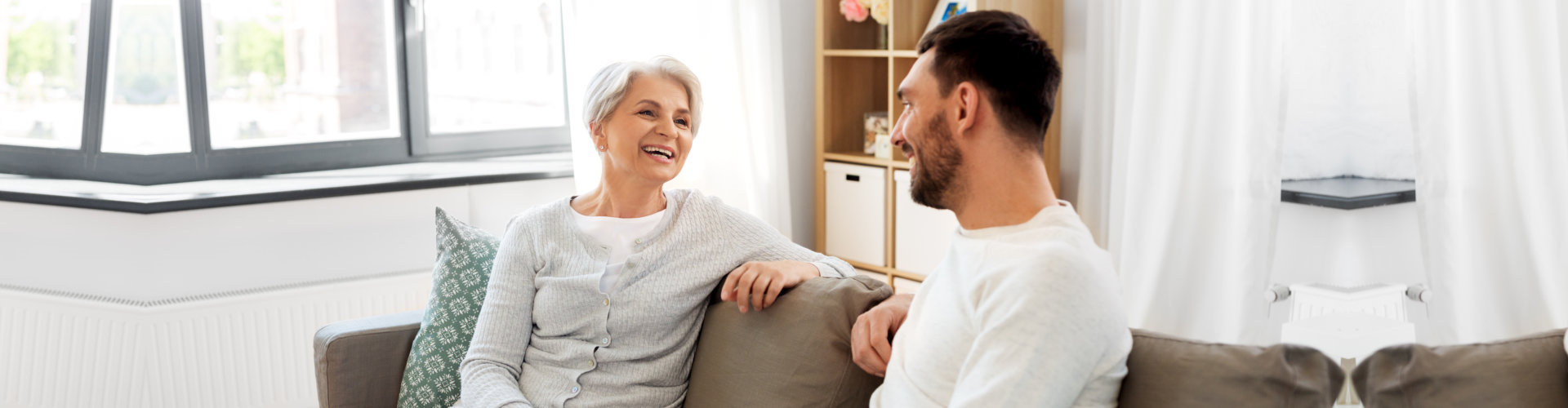 caregiver and senior woman having a conversation