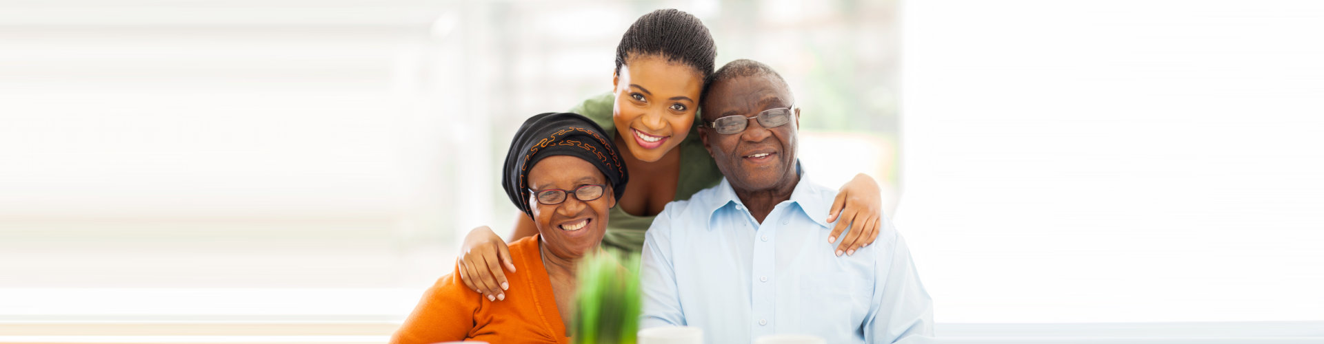 caregiver and couple seniors are smiling